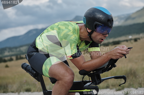 Image of triathlon athlete riding bike