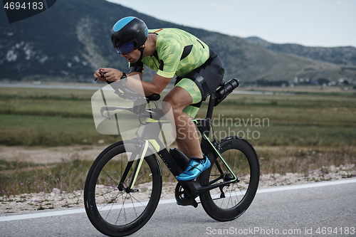 Image of triathlon athlete riding bike