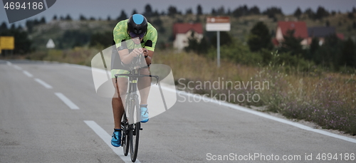 Image of triathlon athlete riding bike