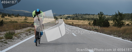 Image of triathlon athlete riding bike