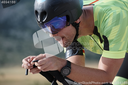 Image of triathlon athlete riding bike