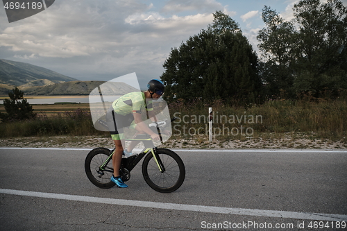 Image of triathlon athlete riding bike