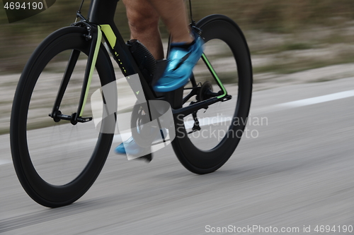 Image of closeup of triathlon athlete riding bike