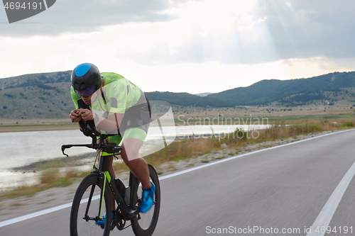 Image of triathlon athlete riding bike