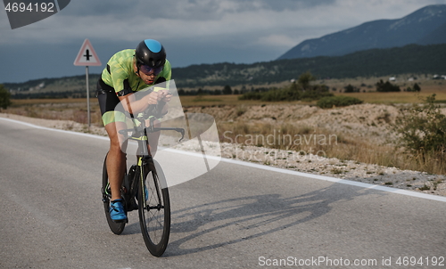 Image of triathlon athlete riding bike