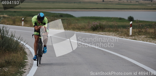 Image of triathlon athlete riding bike