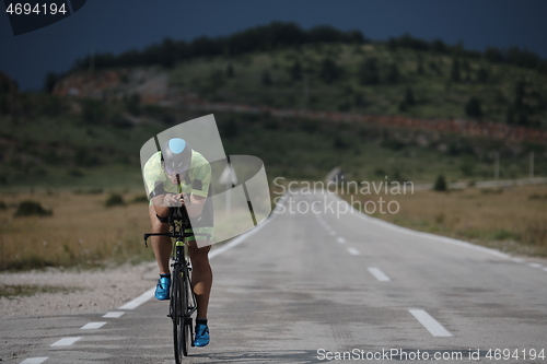 Image of triathlon athlete riding bike