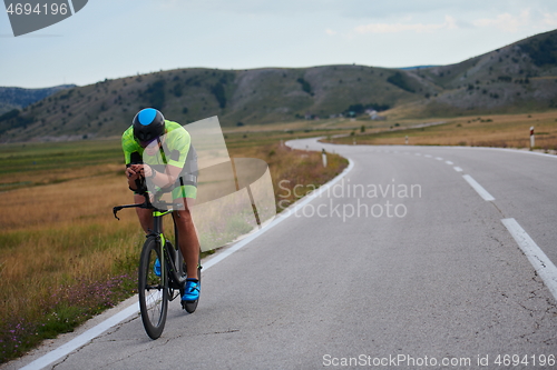 Image of triathlon athlete riding bike