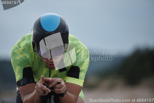 Image of triathlon athlete riding bike