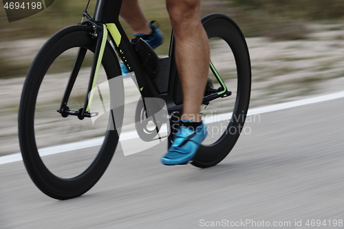 Image of closeup of triathlon athlete riding bike