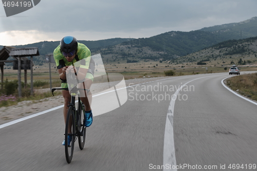 Image of triathlon athlete riding bike