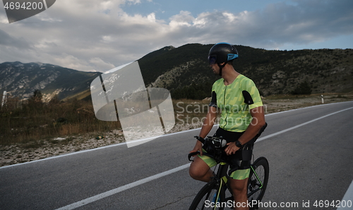 Image of triathlon athlete riding bike