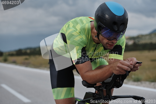 Image of triathlon athlete riding bike