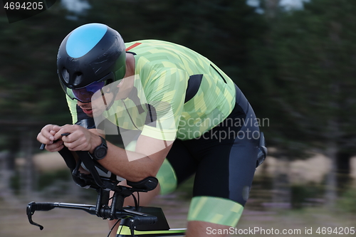 Image of triathlon athlete riding bike