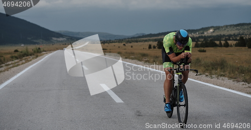 Image of triathlon athlete riding bike