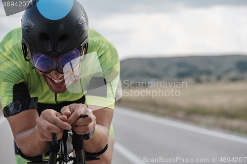 Image of triathlon athlete riding bike