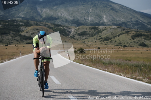 Image of triathlon athlete riding bike