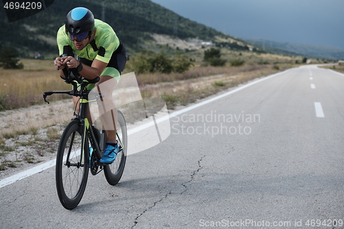 Image of triathlon athlete riding bike