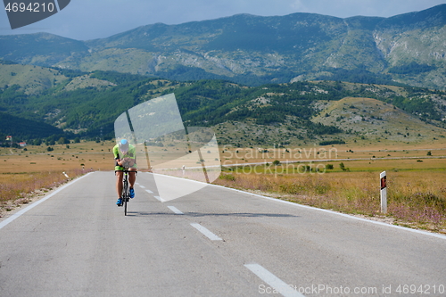 Image of triathlon athlete riding bike