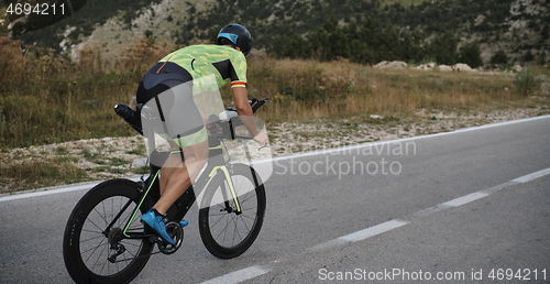 Image of triathlon athlete riding bike