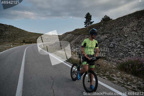 Image of triathlon athlete riding bike