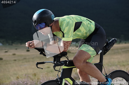 Image of triathlon athlete riding bike