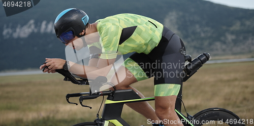 Image of triathlon athlete riding bike