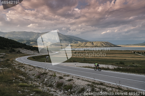 Image of triathlon athlete riding bike