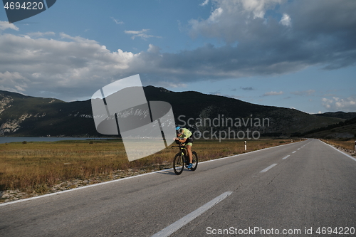 Image of triathlon athlete riding bike