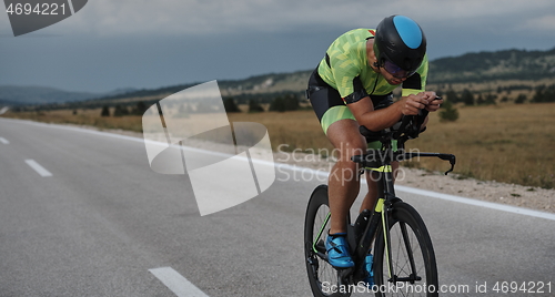 Image of triathlon athlete riding bike