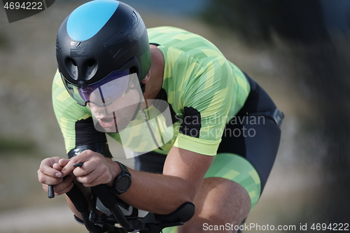 Image of triathlon athlete riding bike