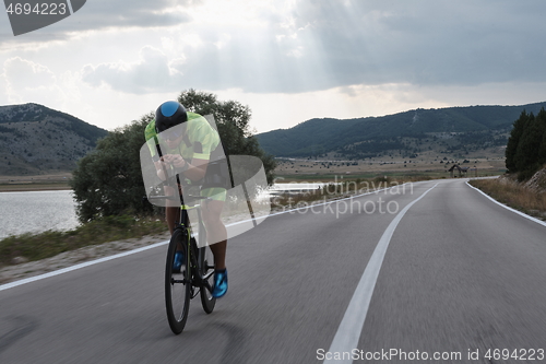 Image of triathlon athlete riding bike