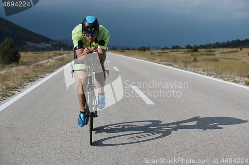 Image of triathlon athlete riding bike