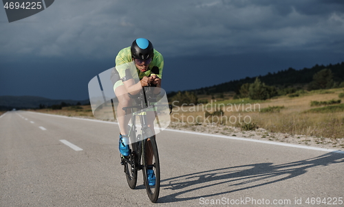 Image of triathlon athlete riding bike