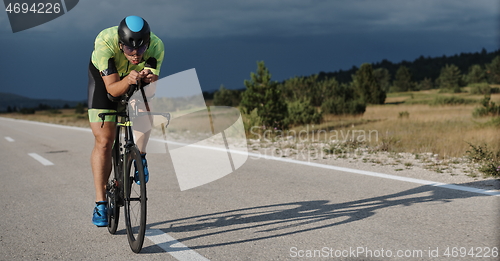 Image of triathlon athlete riding bike