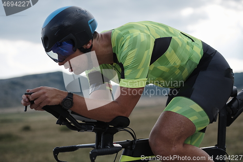 Image of triathlon athlete riding bike