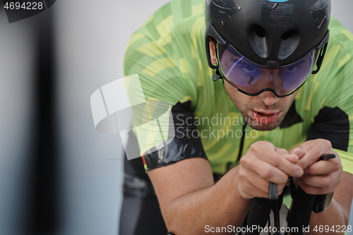 Image of closeup of triathlon athlete riding bike