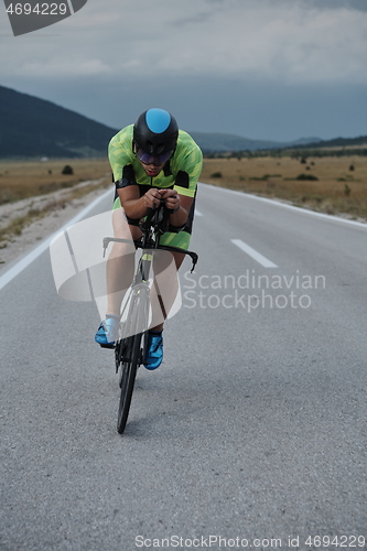 Image of triathlon athlete riding bike