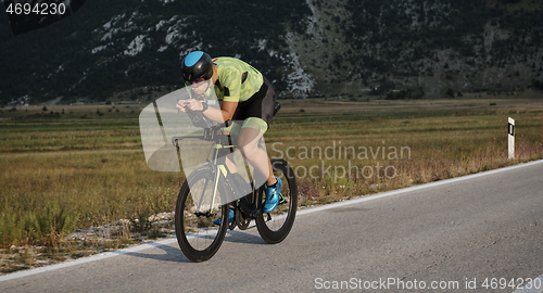 Image of triathlon athlete riding bike