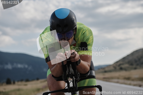 Image of triathlon athlete riding bike