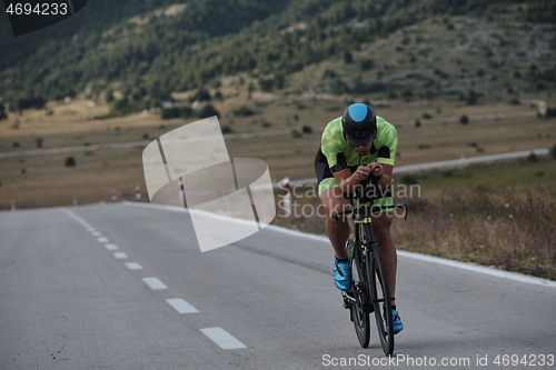 Image of triathlon athlete riding bike