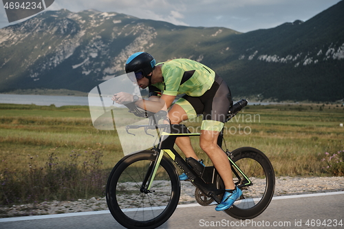 Image of triathlon athlete riding bike