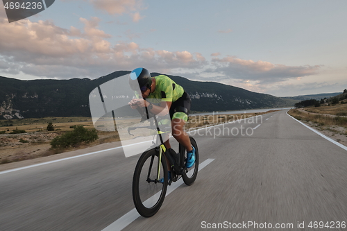 Image of triathlon athlete riding bike