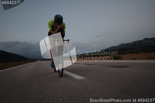 Image of triathlon athlete riding bike