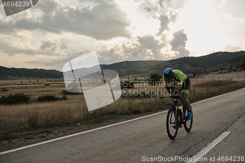 Image of triathlon athlete riding bike