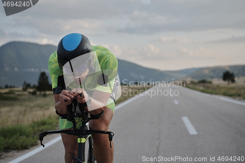 Image of triathlon athlete riding bike