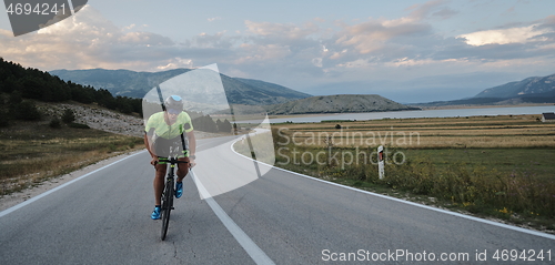 Image of triathlon athlete riding bike