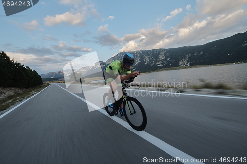 Image of triathlon athlete riding bike