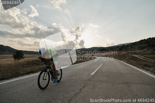 Image of triathlon athlete riding bike