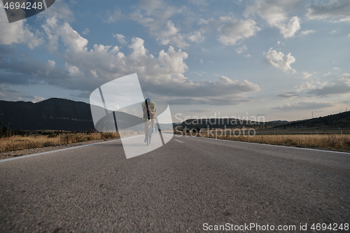 Image of triathlon athlete riding bike